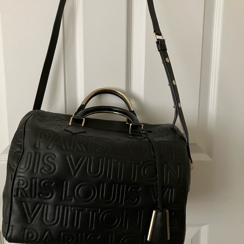 Louis Vuiton Speedy Banouliere leather handbag with strap